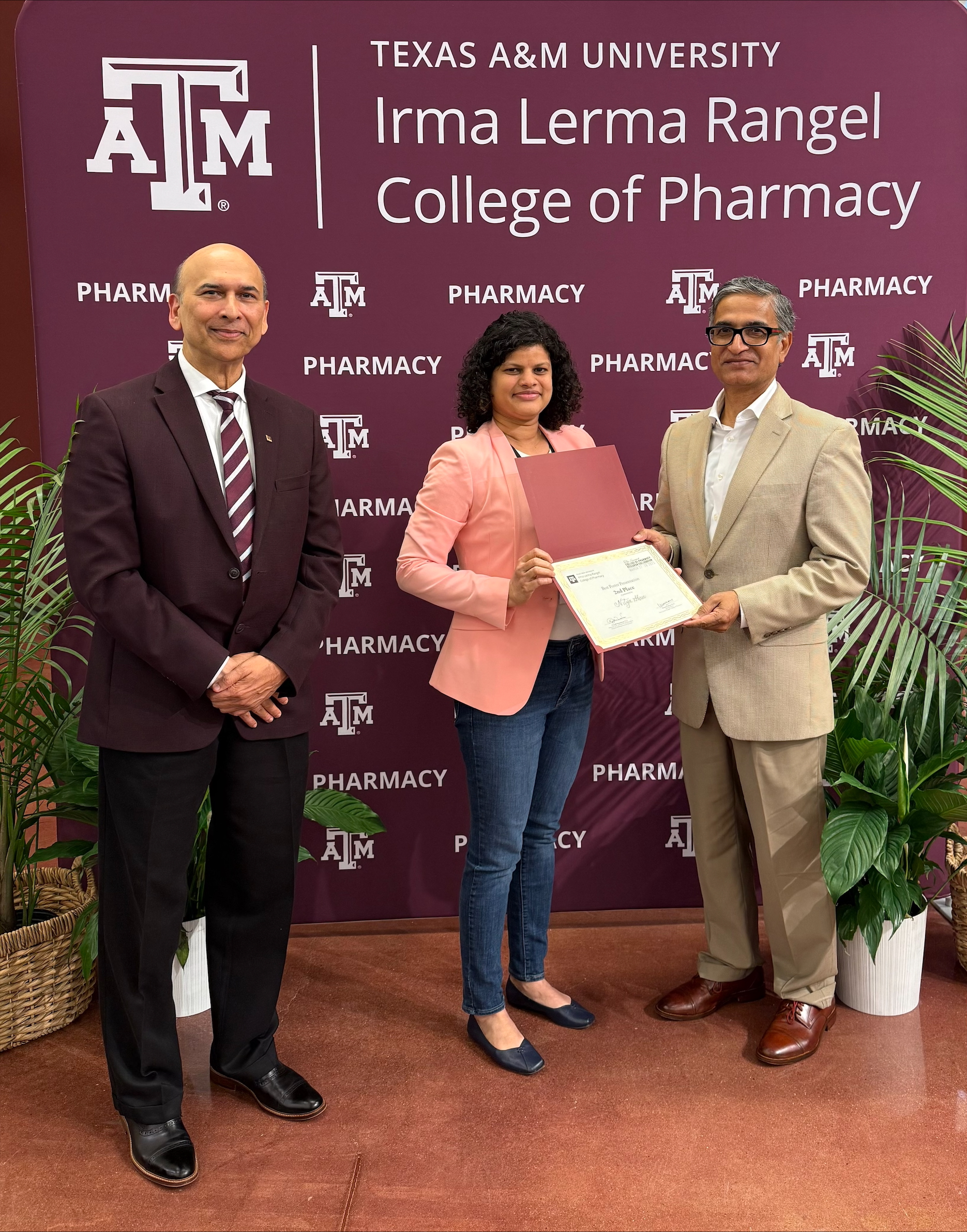 Dr. Nitya Shree Receiving Award. 